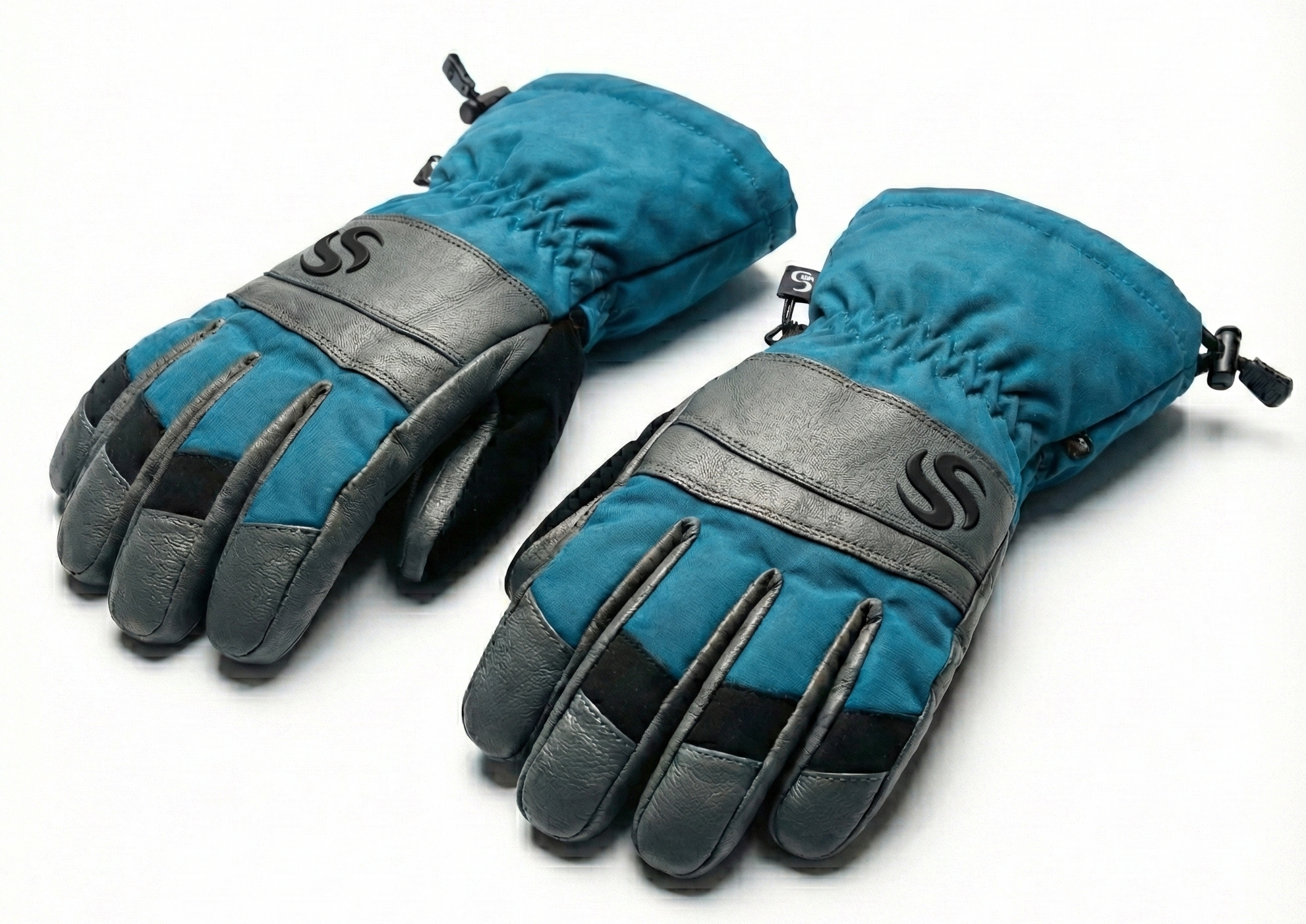 alpine-series-teal-grey-leather-ski-gloves-with-draw-cord-cuff Pair of teal and grey ski gloves with leather knuckle patches and adjustable draw cord cuffs.